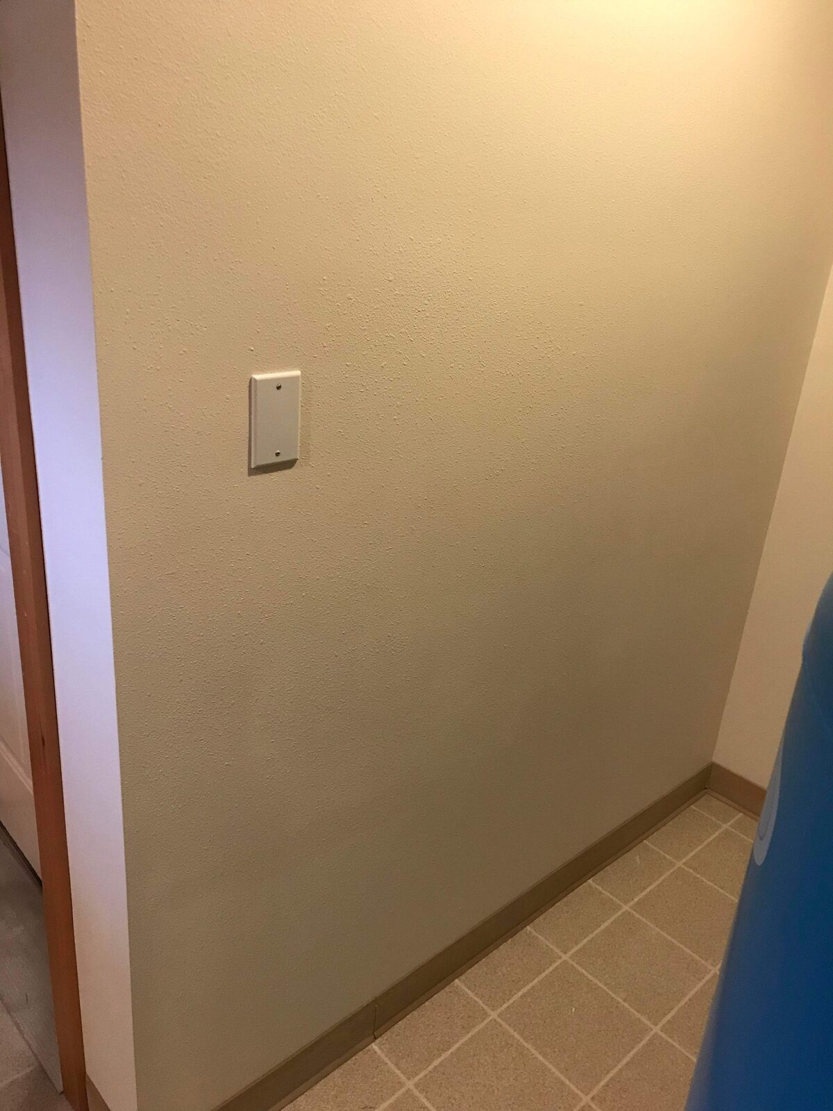 Completed utility room wall with matched texture